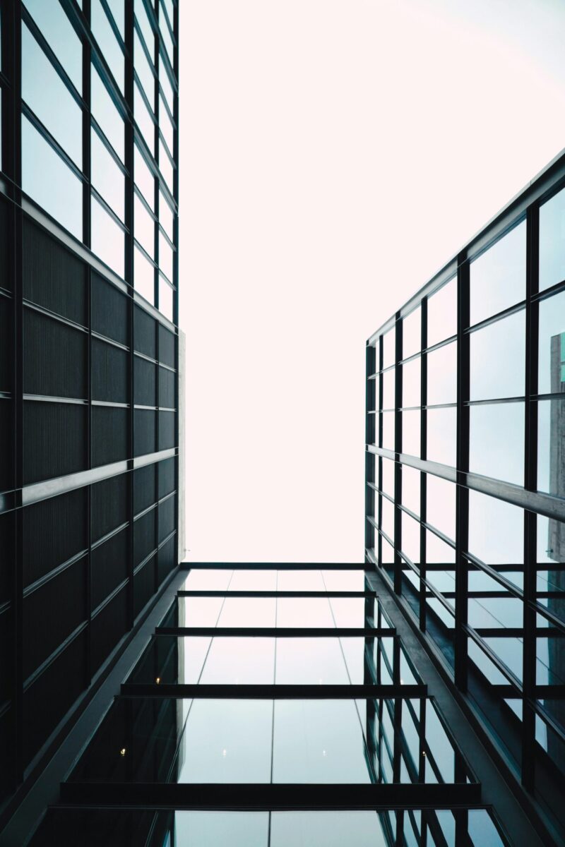 Skyward view of contemporary glass architecture in Santiago, Chile, capturing urban elegance.